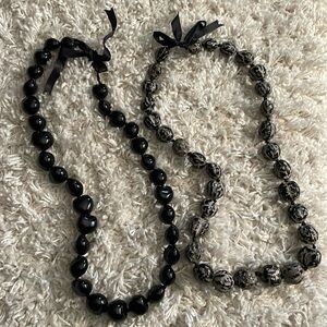 Two Kukui nut leis